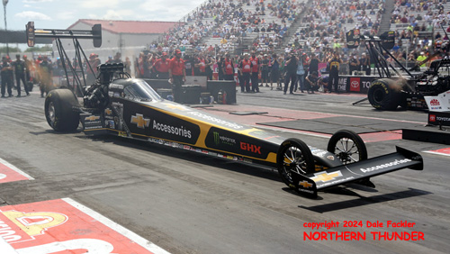 Brittany Force (near lane) vs 
Doug Kalitta (far lane)